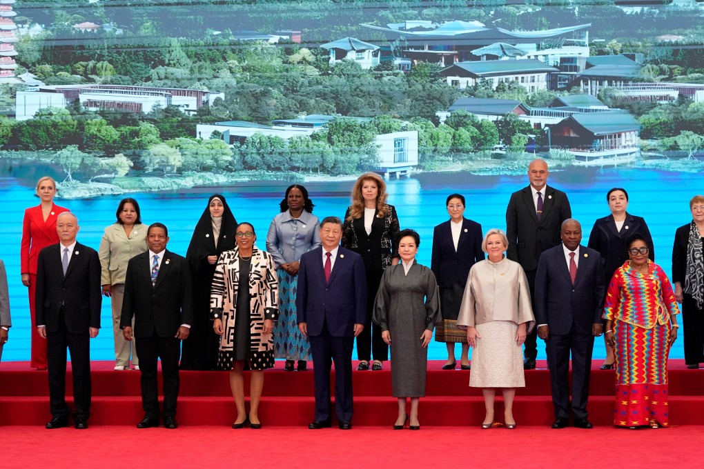 President Xi Jinping and his wife Peng Liyuan pose with national leaders and other delegates ahead of the opening ceremony for the Global Women’s Summit, in Beijing on Monday. Photo: Pool via Reuters