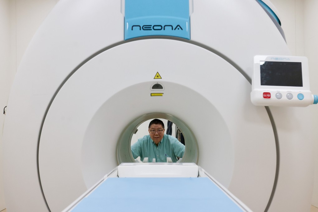 Ma Qiyuan, Time Medical Systems co-founder and chairman, pictured with one of the company’s scanners in its facility in Tai Po on October 6, 2025. Photo: Jonathan Wong