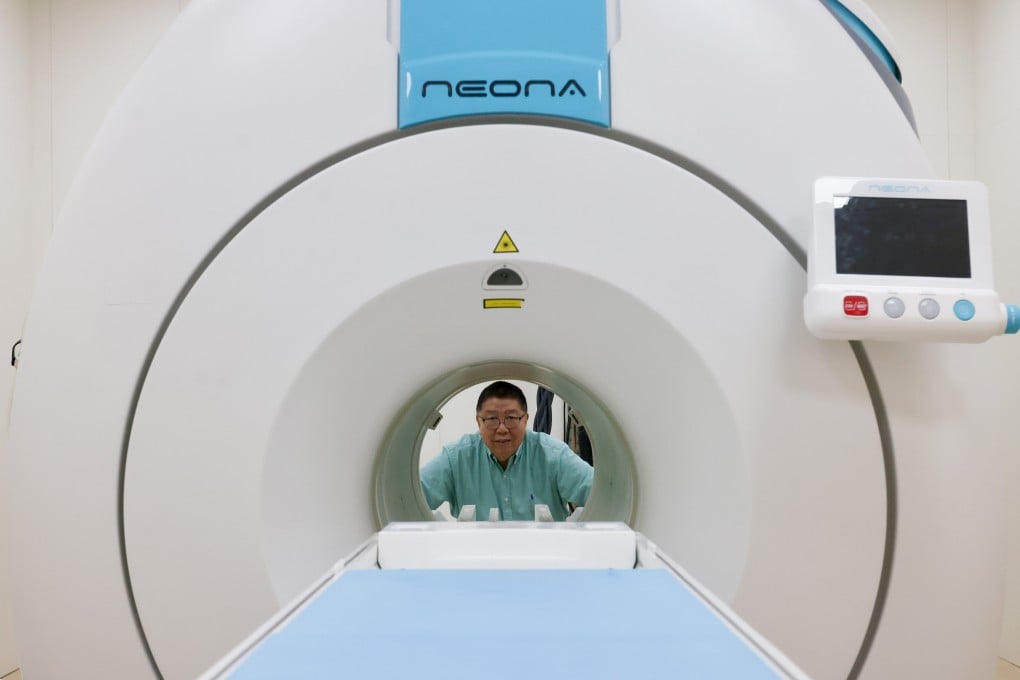 Ma Qiyuan, Time Medical Systems co-founder and chairman, pictured with one of the company’s scanners in its facility in Tai Po on October 6, 2025. Photo: Jonathan Wong