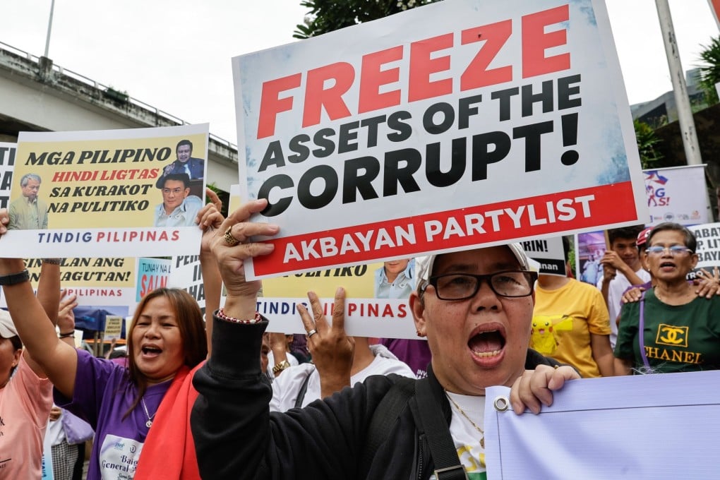 Protesters attend an anti-corruption rally in Quezon City on September 11. A Philippine senator has proposed budget planning using blockchain to monitor funding closely. Photo: EPA