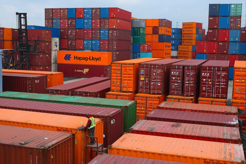 A man welds a cargo container at Malaysia’s Port Klang in September. Growth in Southeast Asia’s export-reliant economies is expected to slow as US levies begin to affect exports and damage supply chains. Photo: EPA