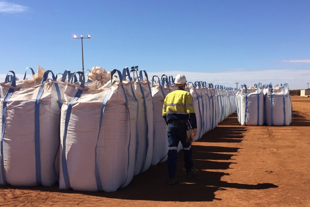 A Lynas Corp worker walks past sacks of rare earth concentrate waiting to be shipped to Malaysia, at Mount Weld, northeast of Perth, Australia in 2019. Photo: 2019