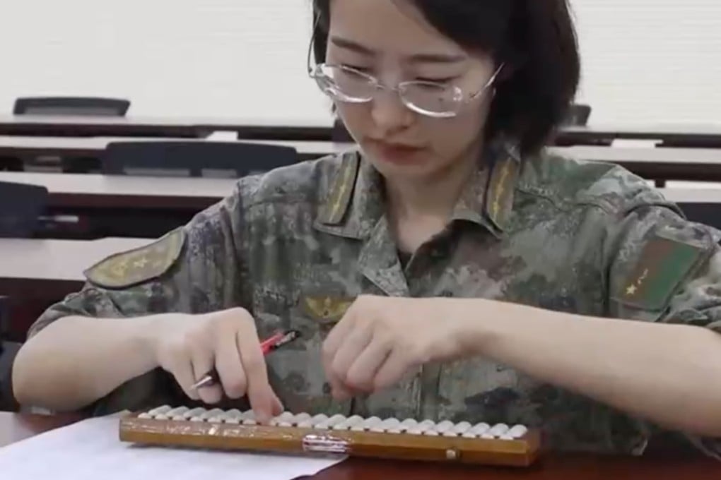 Chinese state media showcases the skills of Captain Xu Meiduo, who teaches soldiers how to use the abacus and other traditional mathematical techniques. Photo: CCTV