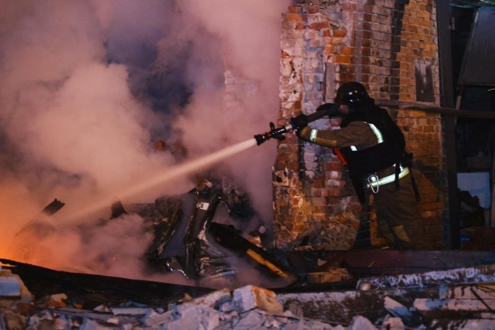 A rescue worker puts out a fire at a hospital damaged by a Russian strike in Kharkiv, Ukraine. Photo: Ukrainian Emergency Service/AP