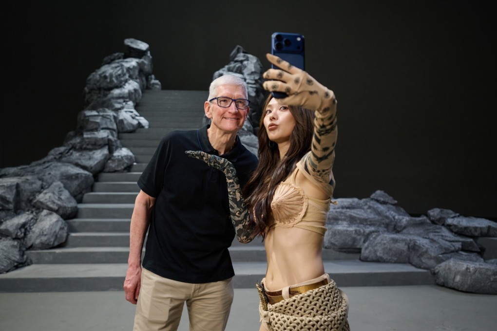 Apple CEO Tim Cook takes a selfie with Chinese singer-actress Wang Feifei at her music video set in Shanghai on Tuesday. Photo: Handout