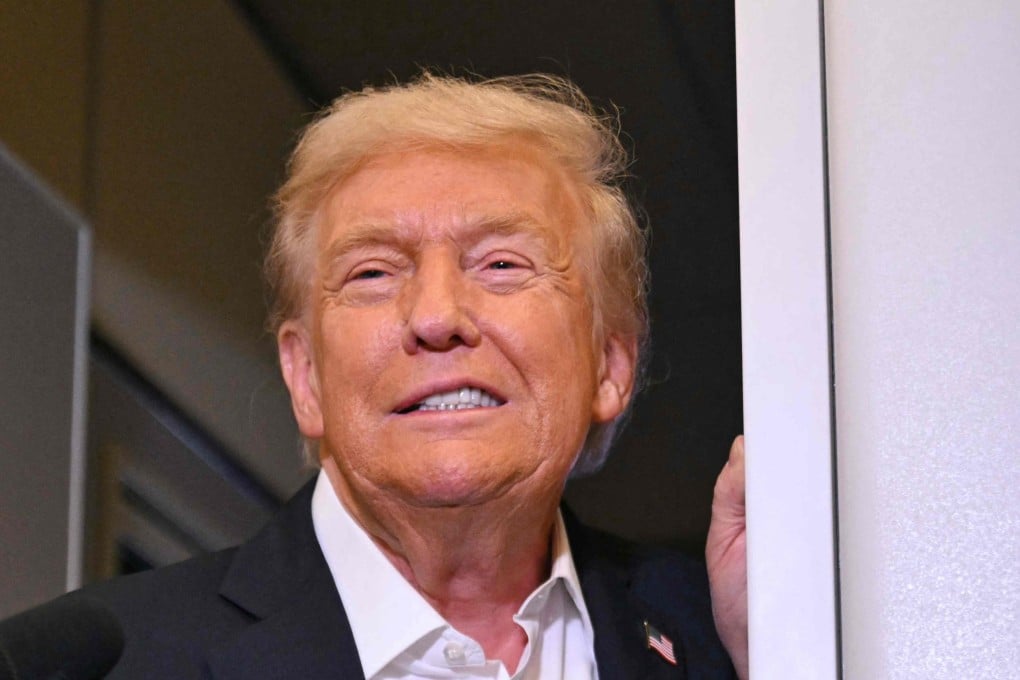 US President Donald Trump speaks with the press on board Air Force One on Thursday. Photo: AFP