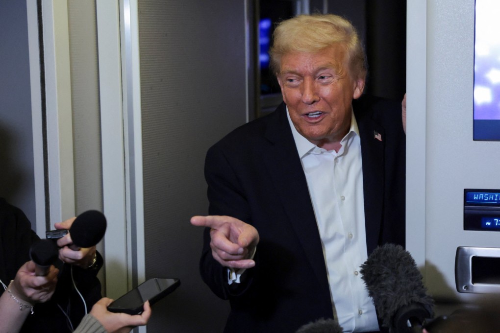 US President Donald Trump speaks to the media aboard Air Force One on Tuesday. Photo: Reuters