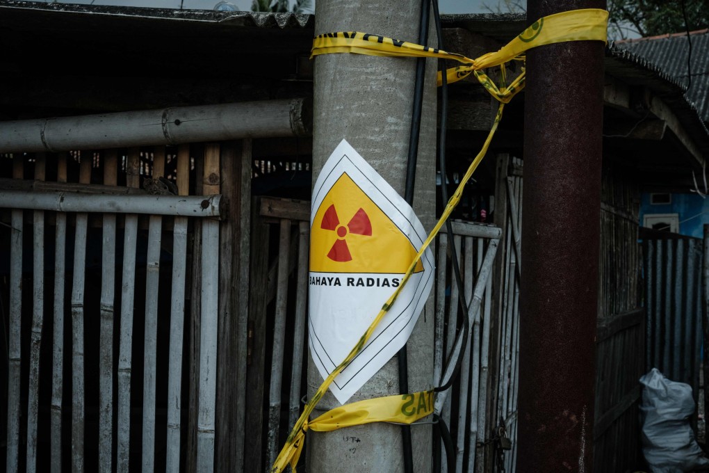 A warning sticker labelled “Danger Radiation” on a power pole next to the Modern Cikande Industrial Estate, where the radioactive isotope Caesium 137 was detected, in Sukatani, Banten, Indonesia. Photo: AFP