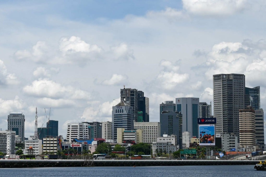 Vehicles travel across the causeway linking Malaysia’s southern Johor state to Singapore on Friday. Photo: AFP