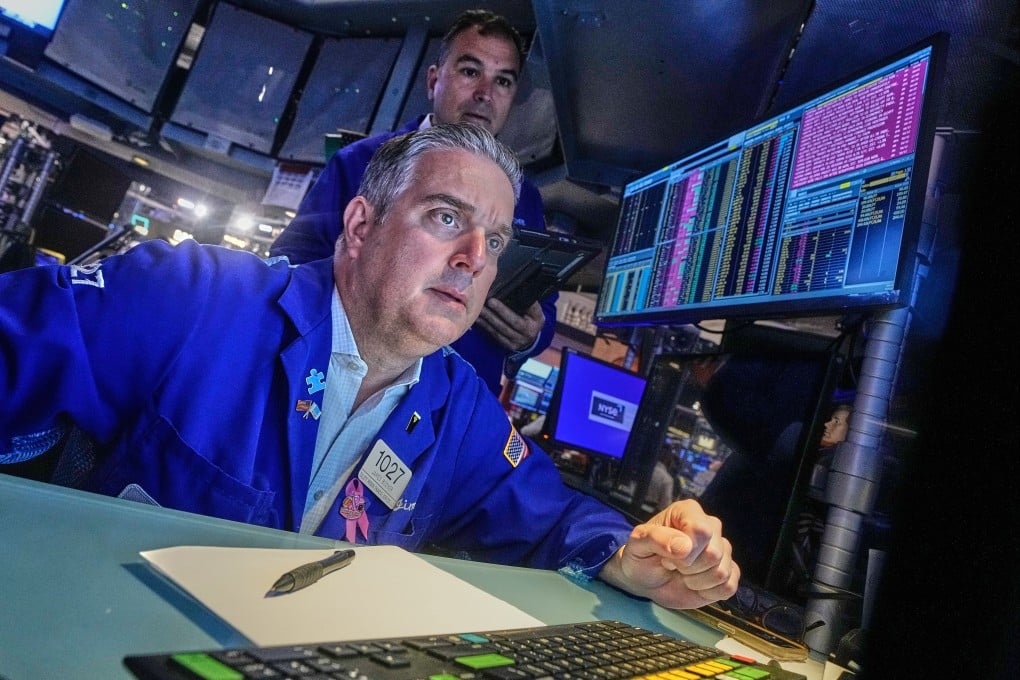 Traders work on the floor of the New York Stock Exchange on Monday. Photo: AP