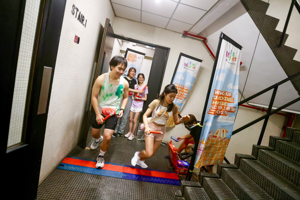 People take part in Walk Up Jardine House 2025. The annual race is organised by Hong Kong charity Mindset to raise money and awareness for mental health in the city. Photo: Jonathan Wong
