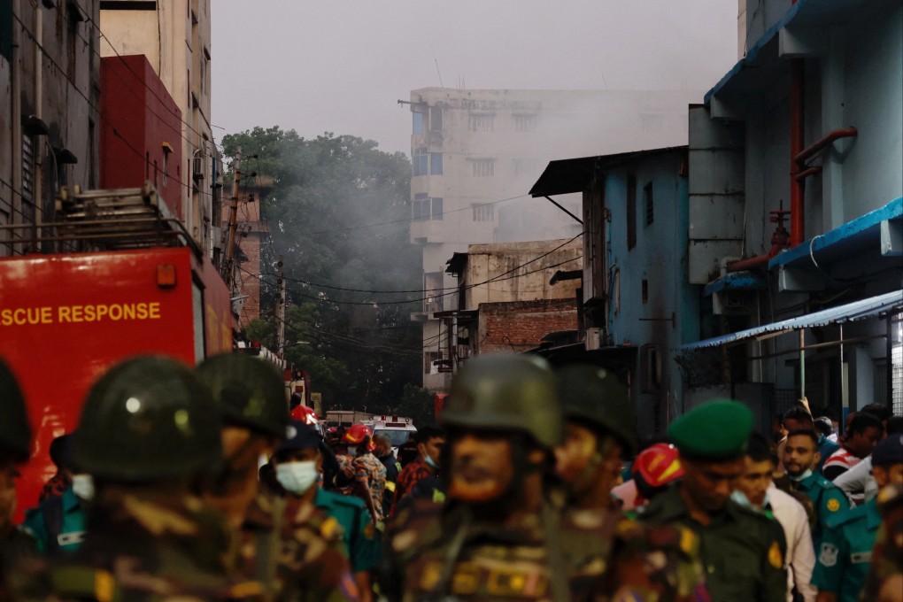 Smoke rises from a building as fire broke out at a garment factory and a chemical warehouse in Dhaka, Bangladesh on Tuesday. Photo: Reuters