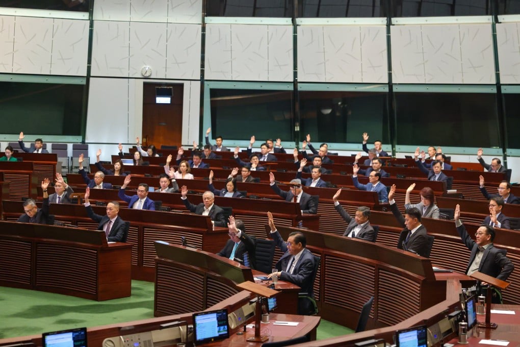Lawmakers pass the bill establishing a regulatory framework for the ride-hailing industry. Photo: Nora Tam