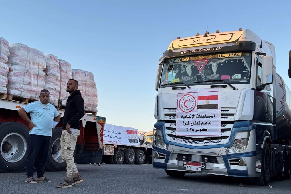 Trucks loaded with humanitarian aid wait on the Egyptian side of the Rafah crossing, before being allowed into the Gaza Strip on Wednesday. Photo: AFP