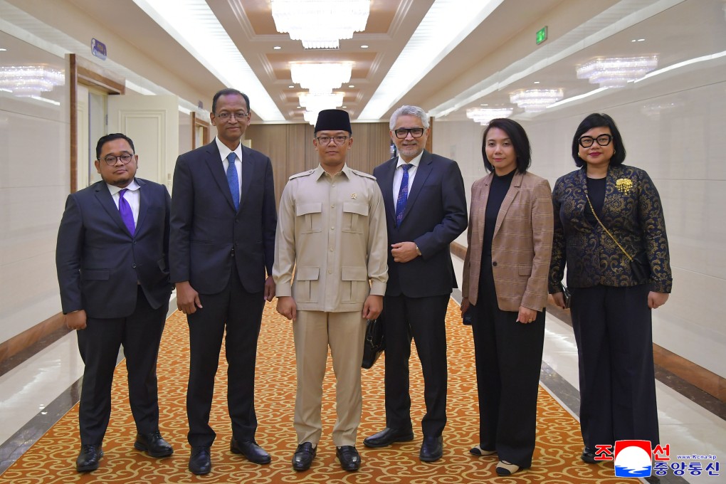 Indonesian Foreign Minister Sugiono (wearing beige) and his delegation arrive in Pyongyang on Friday. Photo: Korean Central News Agency/Korea News Service via AP
