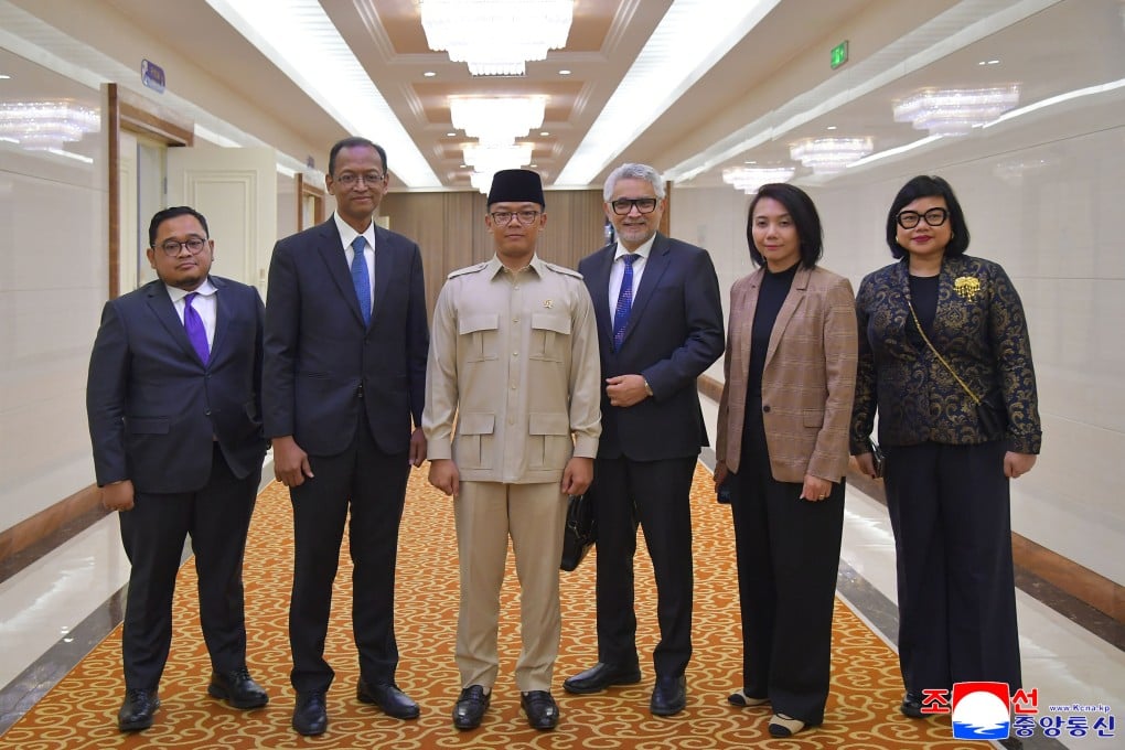 Indonesian Foreign Minister Sugiono (wearing beige) and his delegation arrive in Pyongyang on Friday. Photo: Korean Central News Agency/Korea News Service via AP