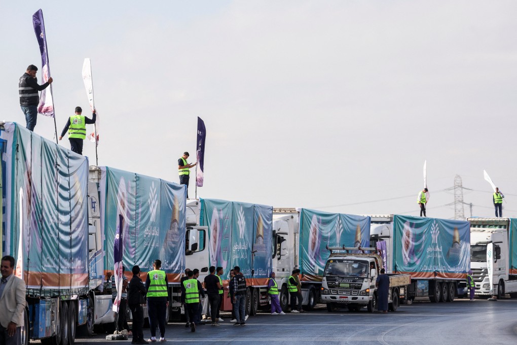 Egyptian trucks carrying humanitarian aid are lined-up as they are on their way to the Rafah border crossing to enter Gaza on Thursday. Photo: Reuters