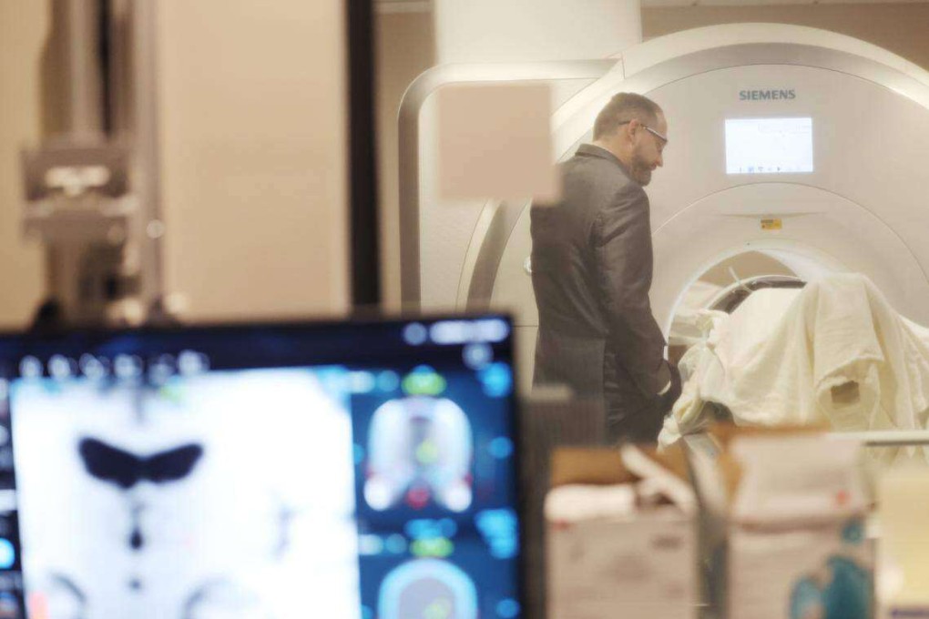 Neurosurgeon Dr Charles Munyon talks to patient Catherine Klie ahead of her incisionless brain surgery to stop her tremors at Novant Health Mint Hill Medical Center in North Carolina, in the US. Klie’s was the 709th procedure of its kind at the centre. Photo: TNS