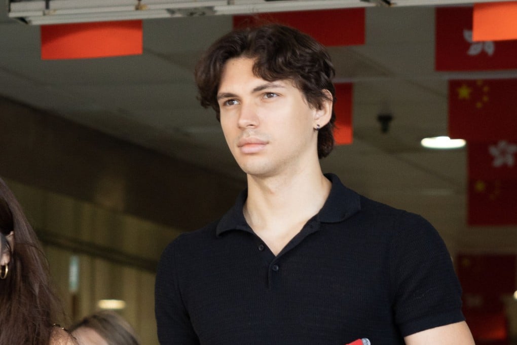 Aliaksandr Buka, right, leaves Eastern Court after being handed a suspended sentence for assaulting two police officers. Photo: Brian Wong