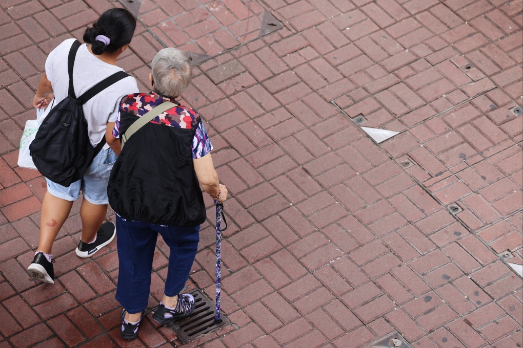 Two people, including a senior resident, walk through Mong Kok on October 10. Photo: Jelly Tse