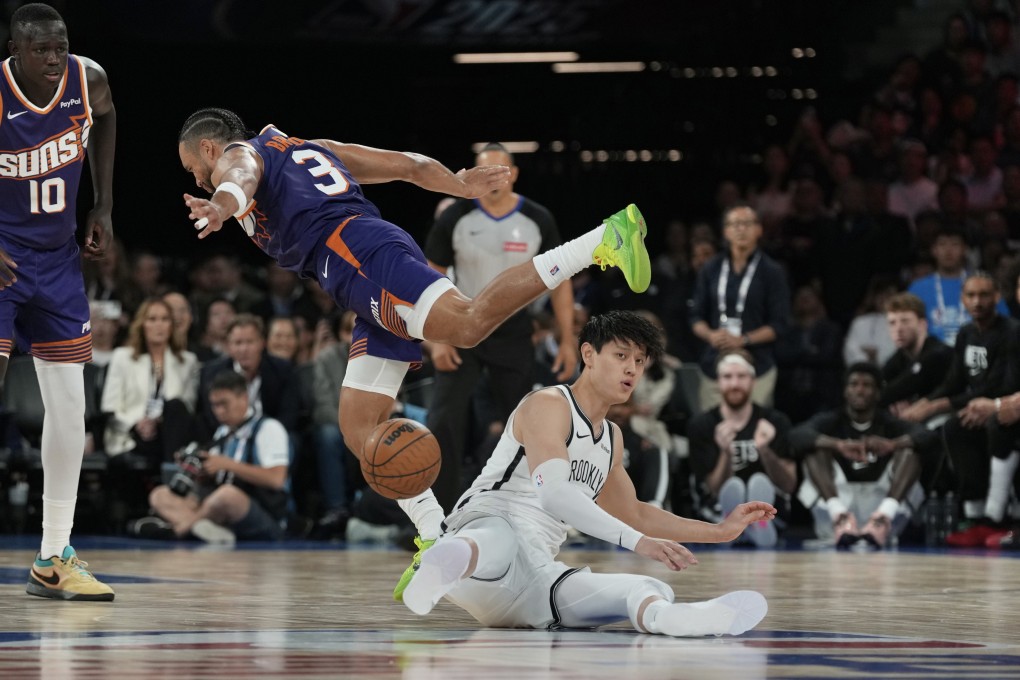 Brooklyn Nets have waived Zeng Fanbo (centre) days after he played against the Phoenix Suns in Macau. Photo: Karma Lo