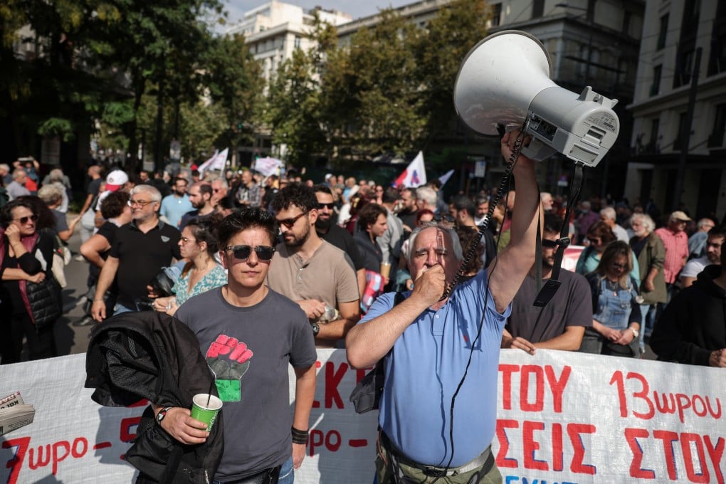 Protesters gather near the Greek parliament in Athens on Tuesday during a one-day strike as lawmakers debate a government plan to allow employers to extend working hours. Photo: Reuters