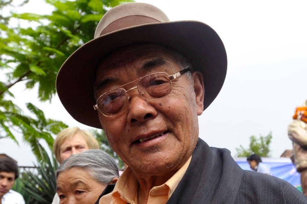 Kanchha Sherpa, a member of the expedition team that placed Tenzing Norgay and Edmund Hillary on the summit of the world’s highest mountain, gestures during a celebration in Kathmandu in 2013. Photo: AFP