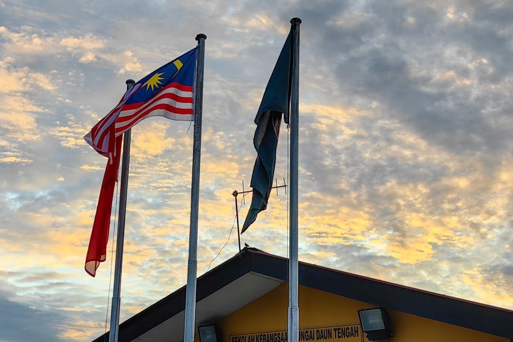 State and country flags fly from flagpoles in a school in Kedah, Malaysia. Photo: Shutterstock