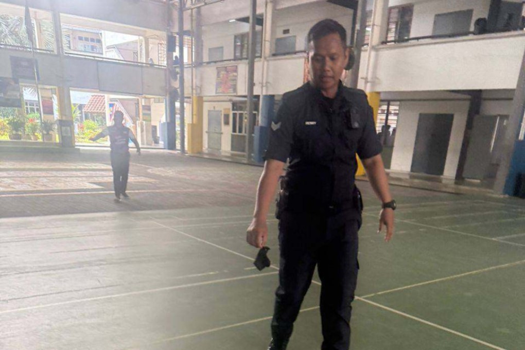 Police at the school, where a girl was stabbed to death in Bandar Utama, Malaysia. Photo: Facebook/NGOGreenProjectMalaysia
