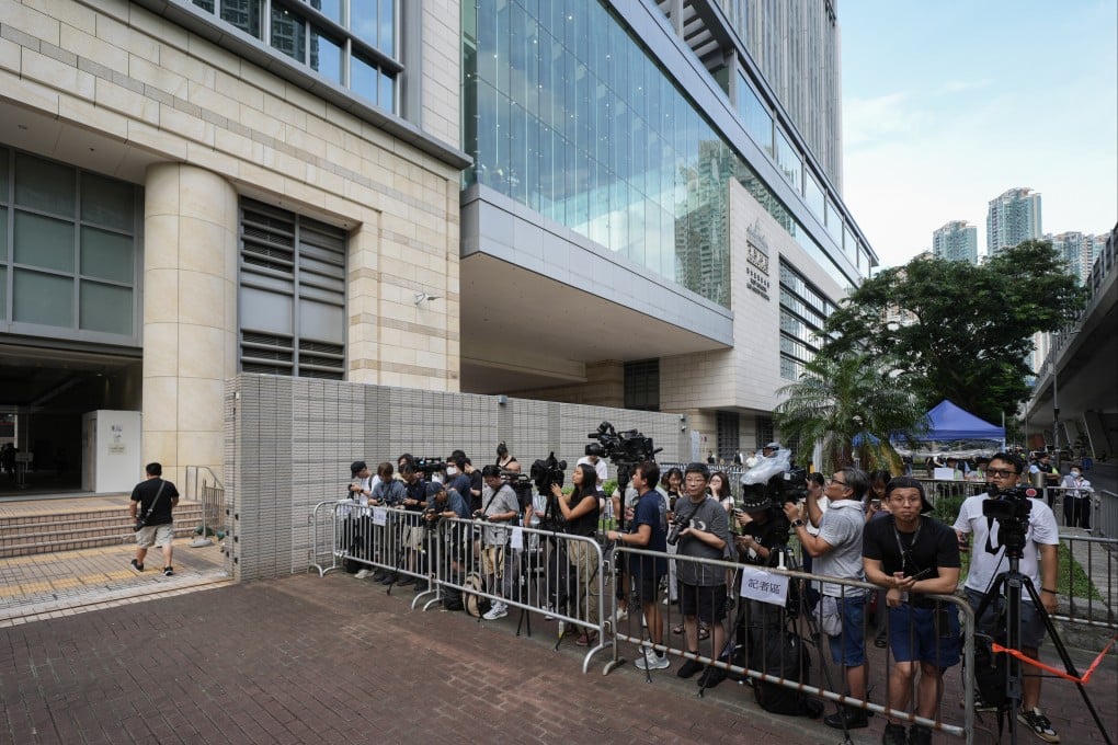 Members of the media gather outside West Kowloon Law Courts Building in Cheung Sha Wan. Photo: Eugene Lee