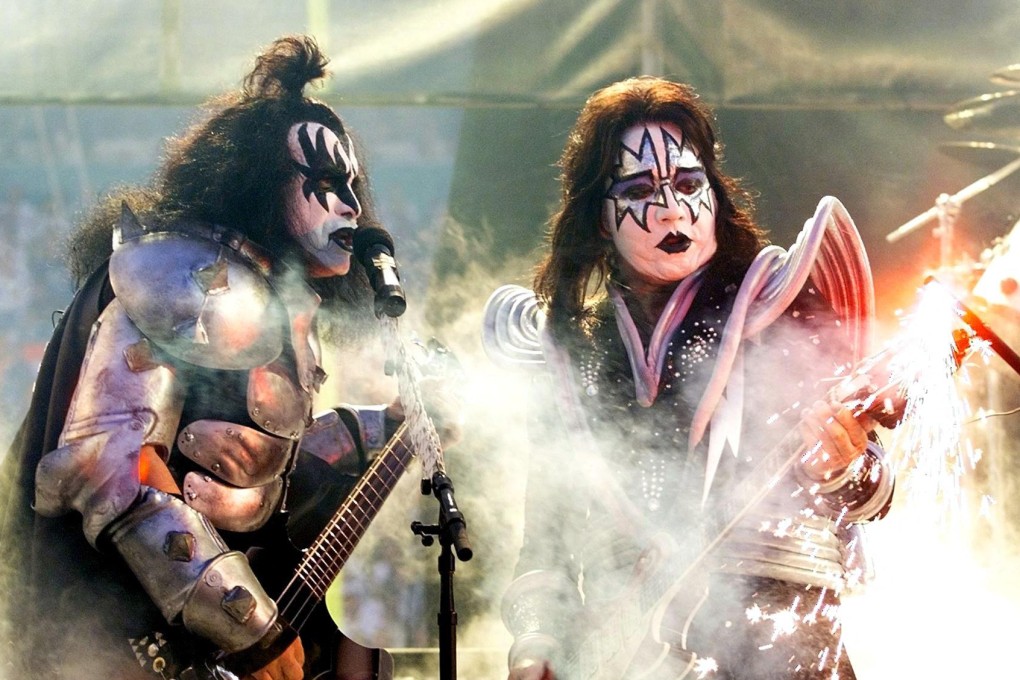 Gene Simmons and Ace Frehley (right) perform before the start of Super Bowl XXXIII in 1999. File photo: AFP