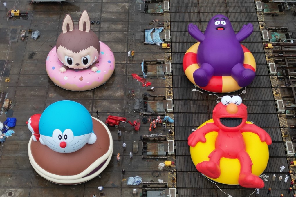 Giant inflatable sculptures of (clockwise from top left) Labubu, Grimace, Elmo and Doraemon are prepared for a sea trial in Tsing Yi, Hong Kong, in September. Photo: Elson Li