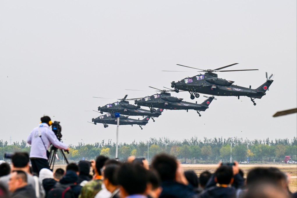 PLA helicopters in action during the opening ceremony of an annual exposition in Tianjin on Thursday. Photo: Xinhua