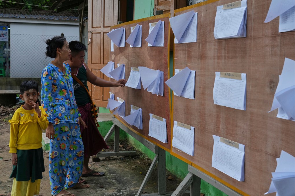 People gather around an officially published eligible-voter list to check names at a ward administrative office in Naypyidaw, Myanmar, on September 30. Photo: AP