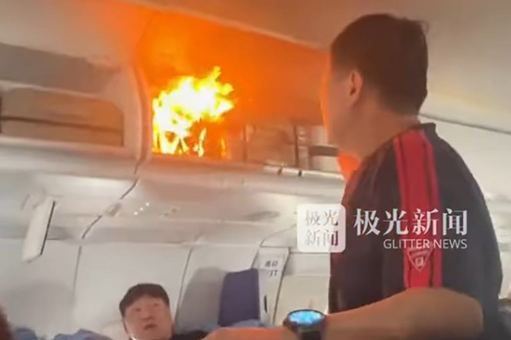 A video clip circulating online showed travellers and crew trying to put out a fire in an overhead compartment. Photo: Handout