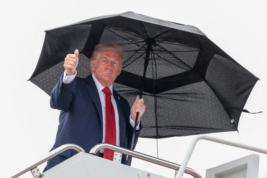 US President Donald Trump gives a thumbs-up while boarding Air Force One last weekend. Photo: Reuters