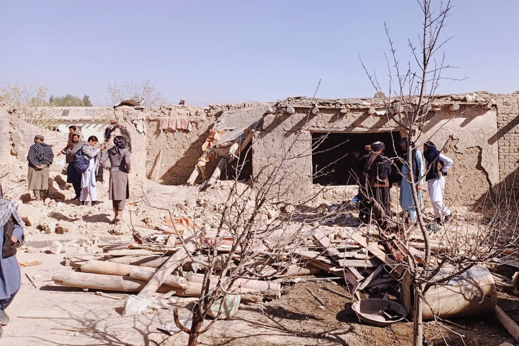 Locals inspect the site of a cross-border attack by the Pakistani army in Afghanistan’s eastern Paktika province on Saturday. Photo: AP