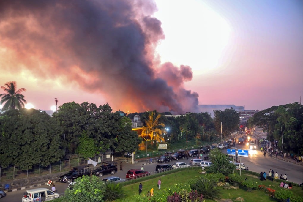 Smoke rises from the international airport in Dhaka, Bangladesh, on Saturday. Photo: EPA-EFE