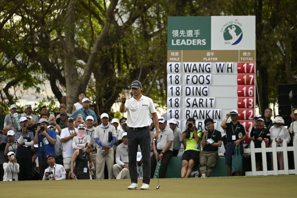 Dominic Foos line sup his winning putt on the 18th green at Macau Golf and Country Club. Photo: Asian Tour