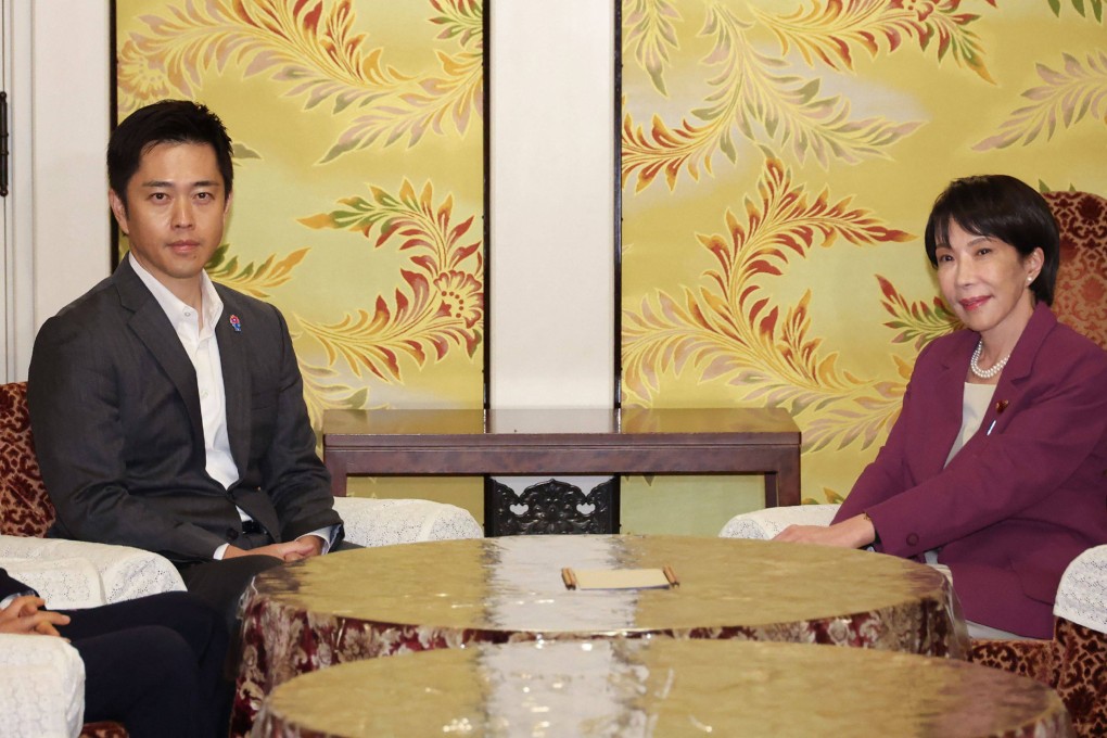 LDP leader Sanae Takaichi (right) and JIP chief Hirofumi Yoshimura attend a meeting at the Diet in Tokyo on Wednesday. Photo: JIJI Press/AFP