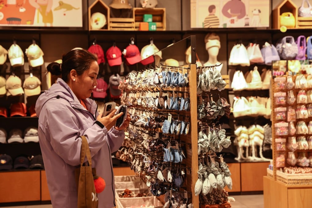 A woman shops in a clothing store in Beijing on September 15. Photo: EPA