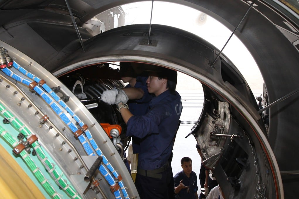 Engine maintenance is demonstrated on a Hong Kong Airlines plane at Hong Kong airport in 2012. Photo: SCMP