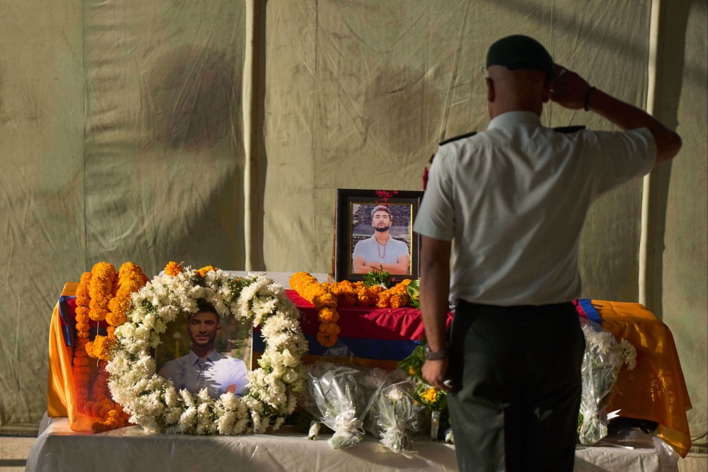 A member of the Nepalese army pays his respects to Bipin Joshi, a Nepali man who was taken hostage by Hamas, during a memorial procession at the Kathmandu airport in Nepal. Photo: AP