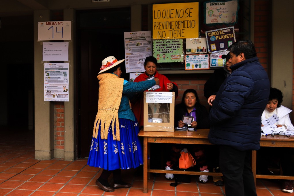 A woman casts her ballot during the second round of elections to choose the president and vice-president in La Paz, Bolivia on Sunday. Photo: EPA
