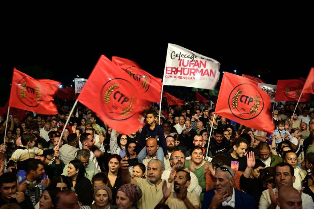 Supporters of newly elected leader Tufan Erhurman celebrate after winning the leadership election in the Turkish occupied northern part of Cyprus’ divided capital Nicosia on Sunday. Photo: AP