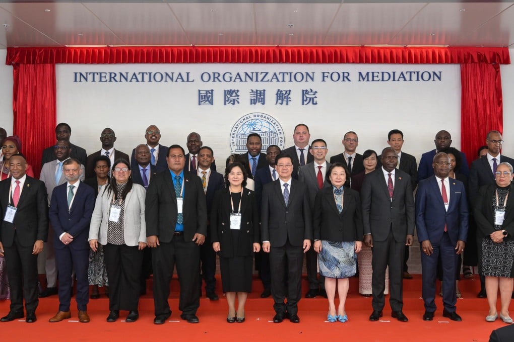 Hua Chunying (fifth left, front) with Chief Executive John Lee (centre) and Teresa Cheng (fifth right), the organisation’s secretary general, at the inauguration ceremony. Photo: Handout
