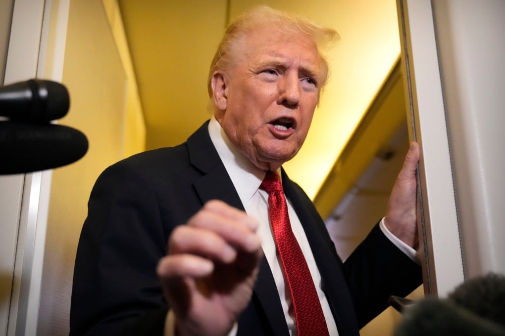 US President Donald Trump speaks to reporters aboard Air Force One on Sunday. Photo: AP