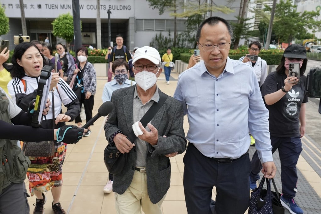 Ho Huen (grey jacket), 77, known on the Internet as “Mr Ho”, leaves Tuen Mun Magistrates’ Court on Tuesday after being given a suspended jail sentence. Photo: Karma Lo