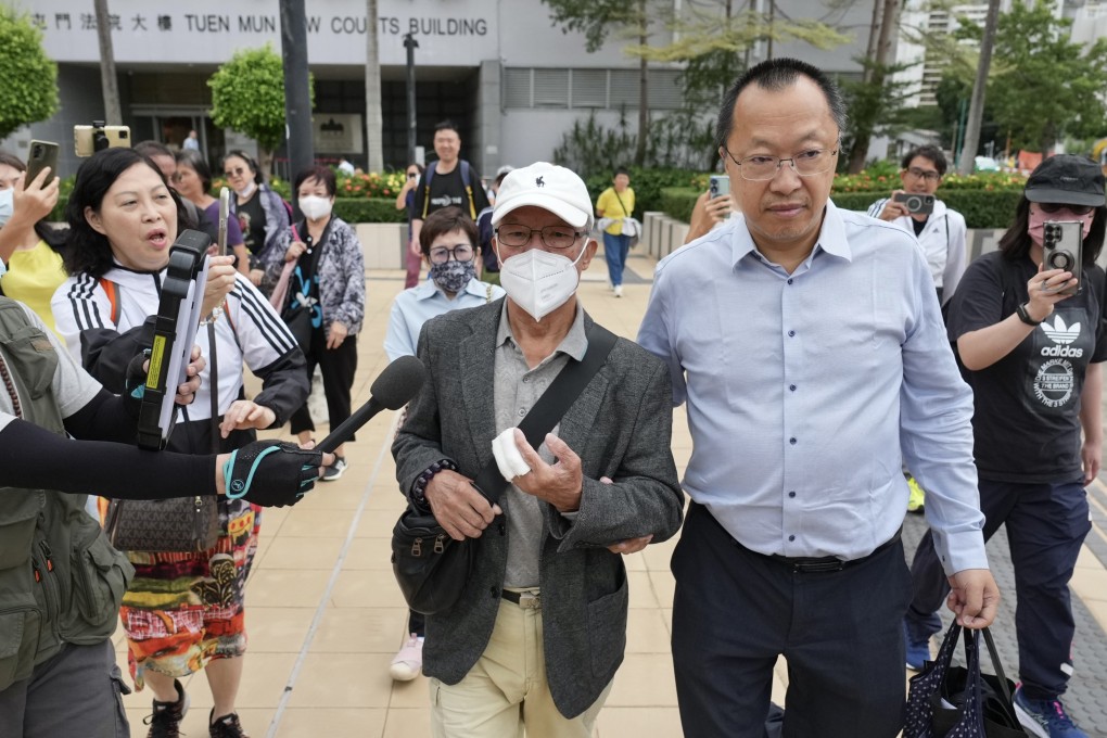 Ho Huen (centre), 77, known on the Internet as “Mr Ho”, leaves Tuen Mun Court on Tuesday after being given a suspended jail sentence. Photo: Karma Lo