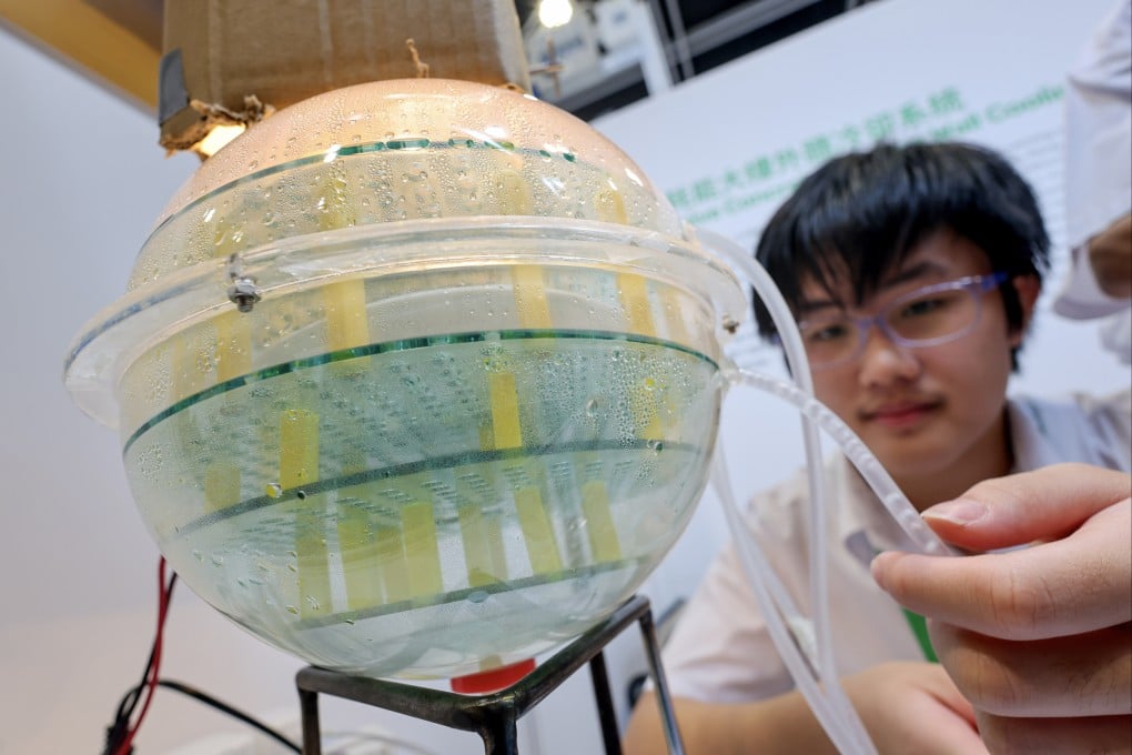 Students from Bishop Hall Jubilee School present a low-energy cooling system for building facades at the Hong Kong Science Fair on June 28. Photo: Dickson Lee
